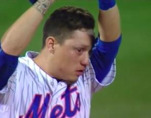 An emotional Wilmer Flores fights tears last Thursday after thinking he was traded by the Mets. Instead, he stayed and hit a walkoff home run Friday to propel the Amazin's to a sweep of the Nationals and a first place tie. Getty Images